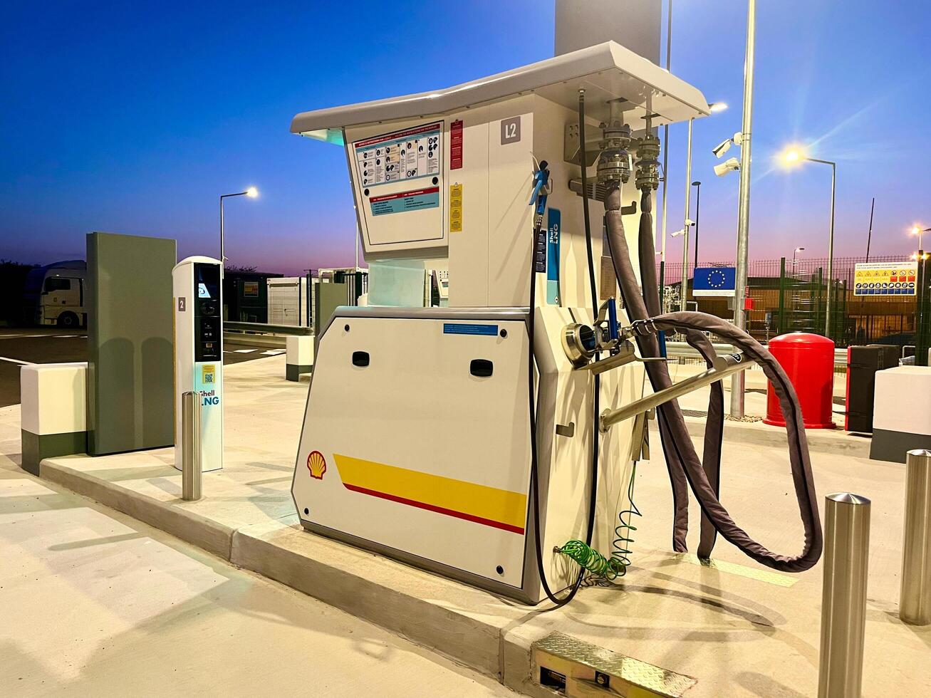 France - 09.18.2024 Sunset at Shell LNG filling station. State-of-the-art liquefied natural gas LNG infrastructure against a picturesque evening sky photo