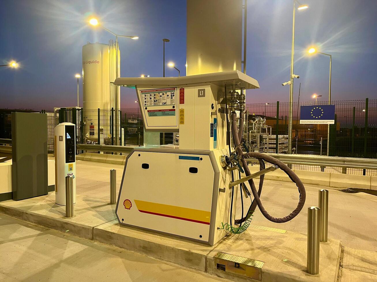 France - 09.18.2024 Sunset at Shell LNG filling station. State-of-the-art liquefied natural gas LNG infrastructure against a picturesque evening sky photo