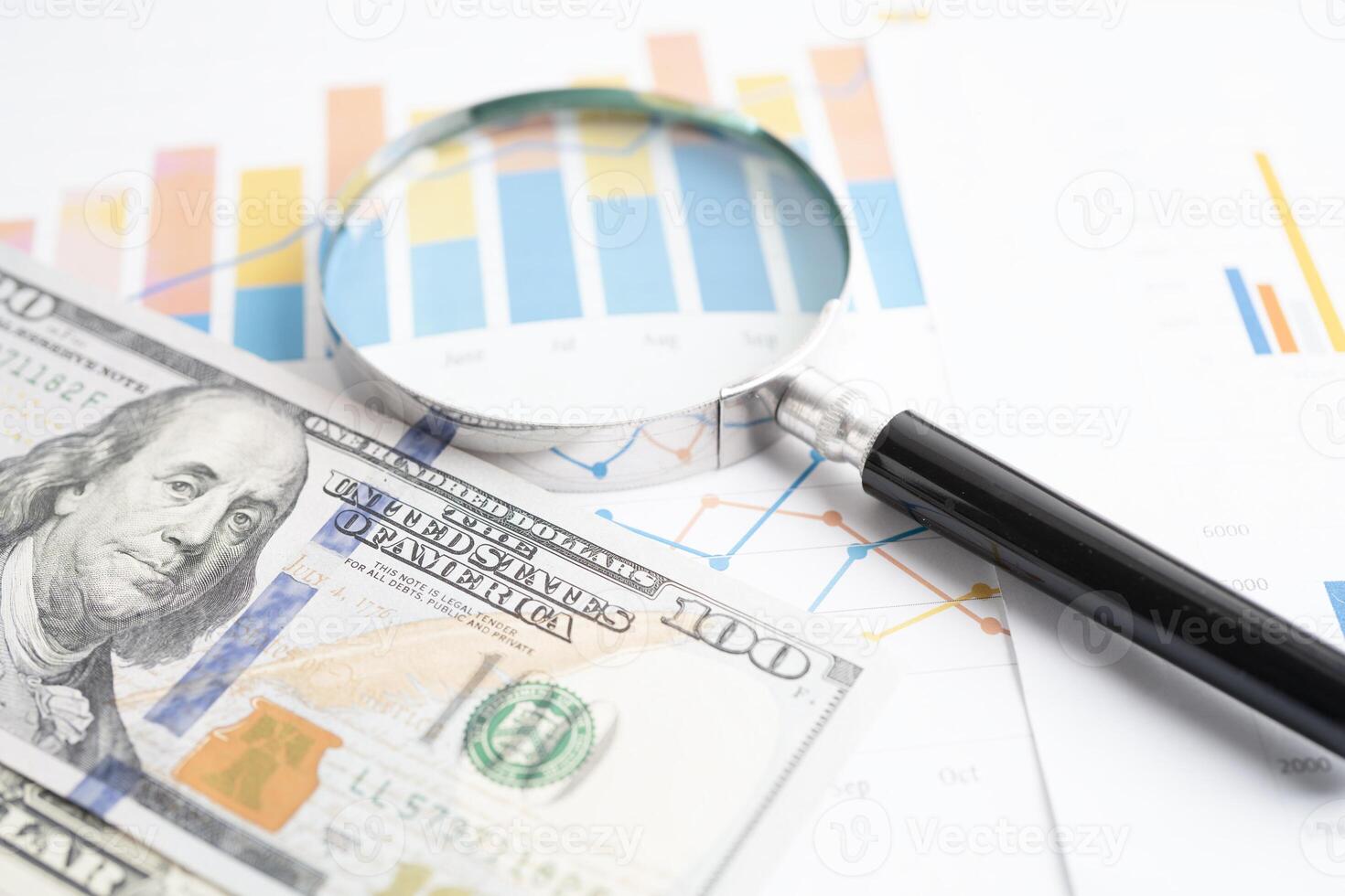 Stethoscope and US dollar banknotes on chart or graph paper, Financial, account, statistics and business data medical health concept. photo