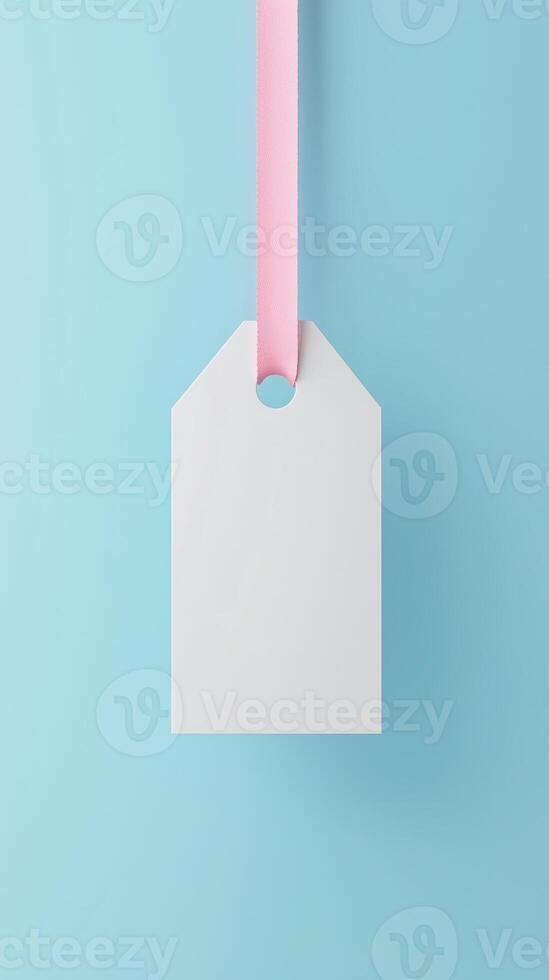 Rectangular white blank paper tag label price tag with hanging rope isolated blue photo