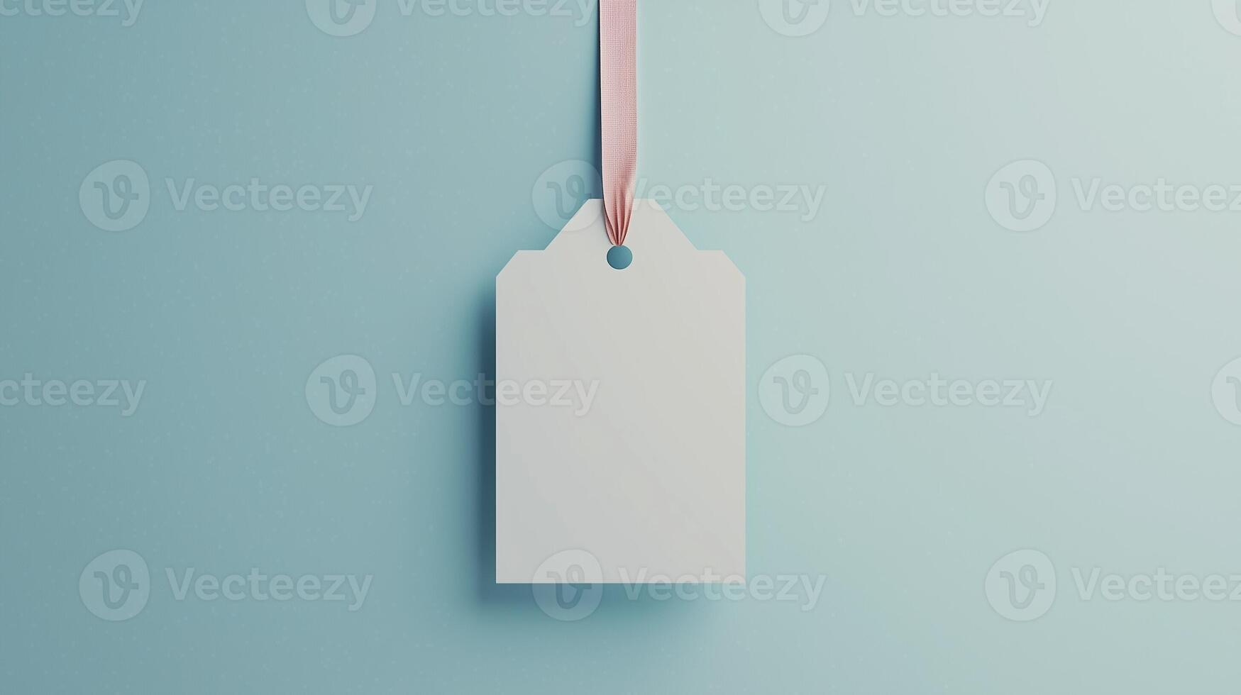 Paper price tag label white brand name with rope on solid blue background photo