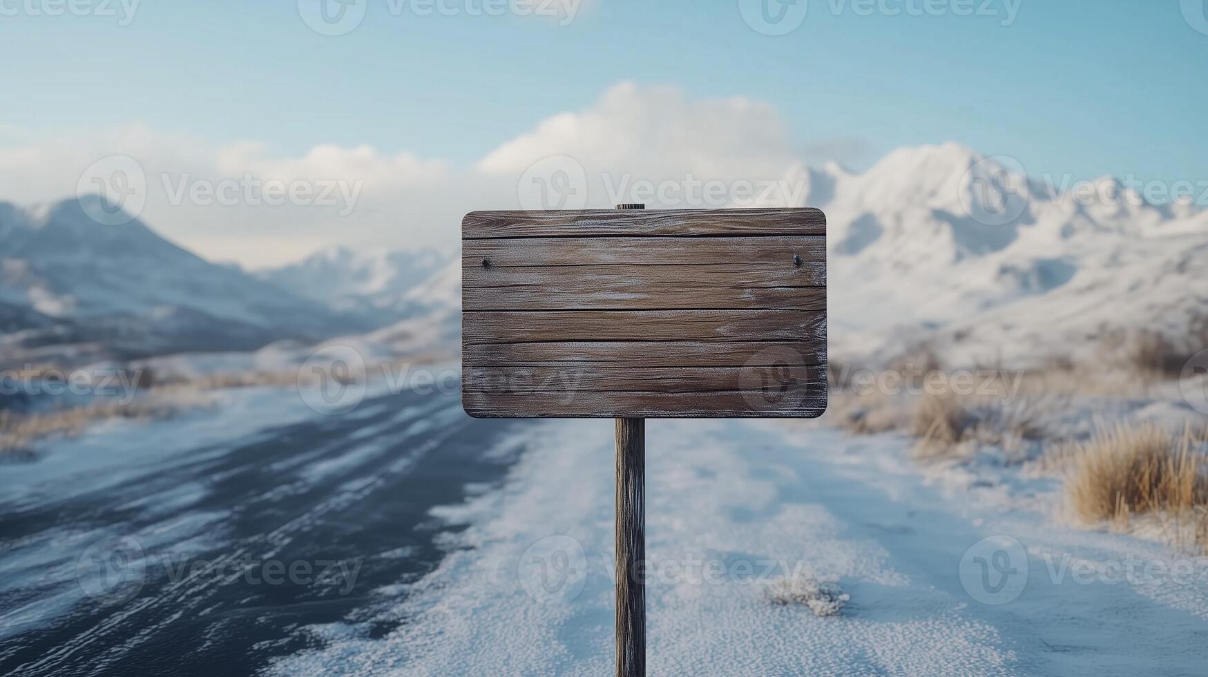 Wooden brown plank sign in winter road guiding direction of destination photo