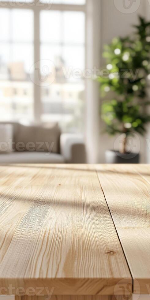 Bright and airy living room with wooden table and green plant in sunlight photo