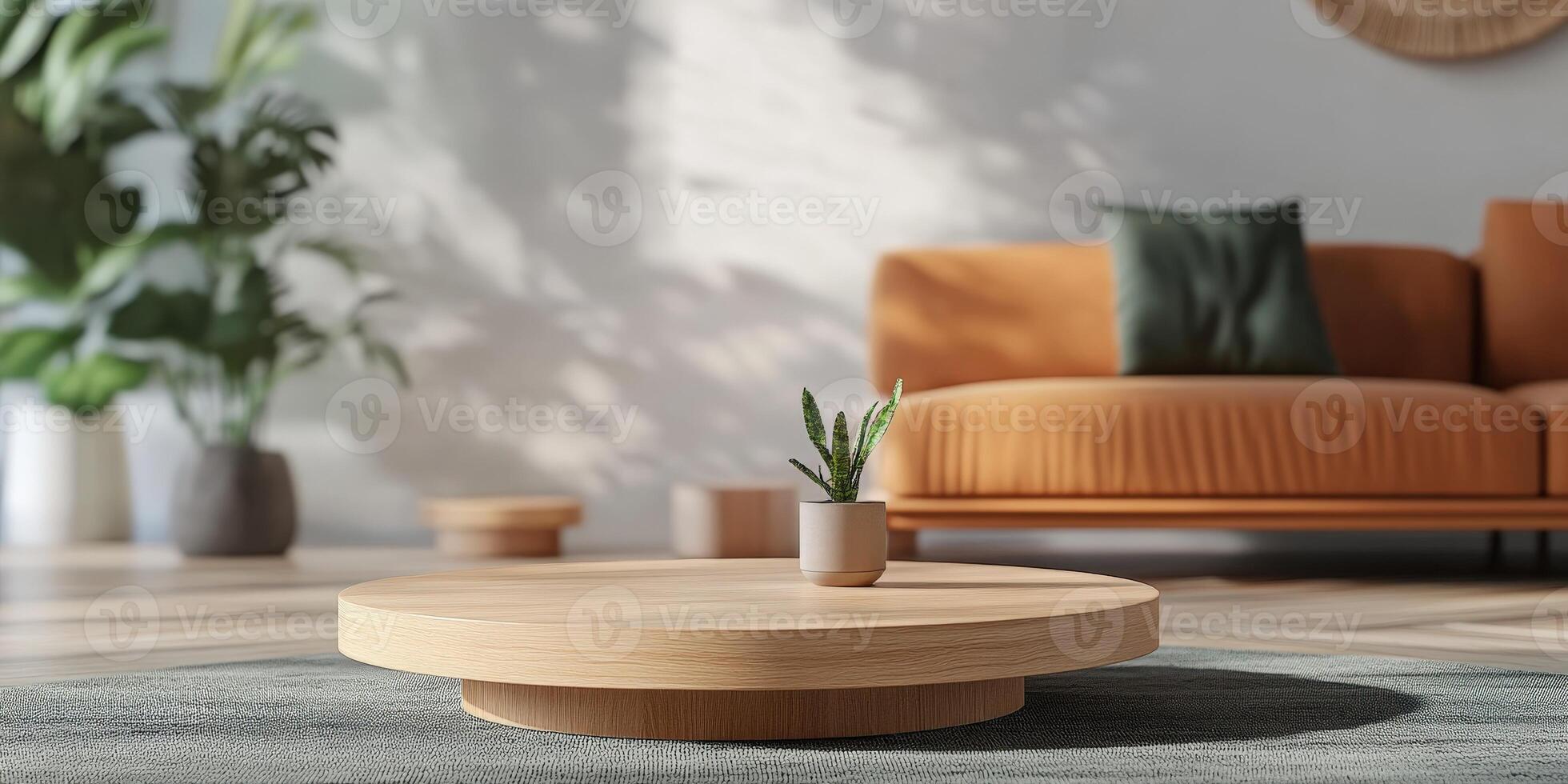 Modern living room with wooden coffee table and potted plant in sunlight photo