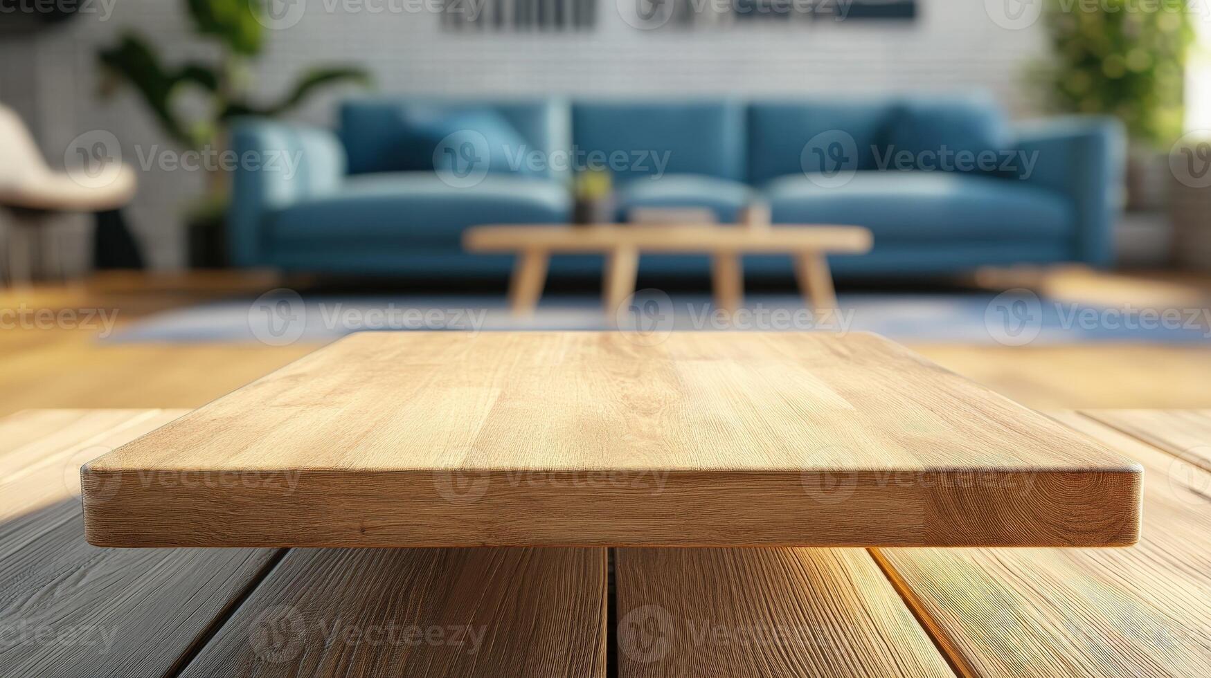 Wooden tabletop in modern living room with blue sofa and decor photo
