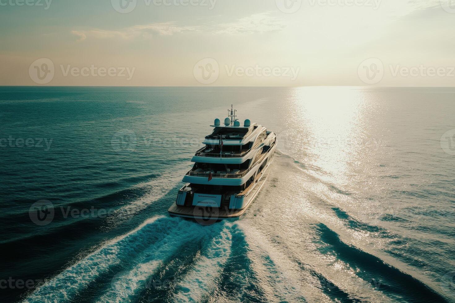 Luxurious yacht cruising over tranquil waters at sunset photo