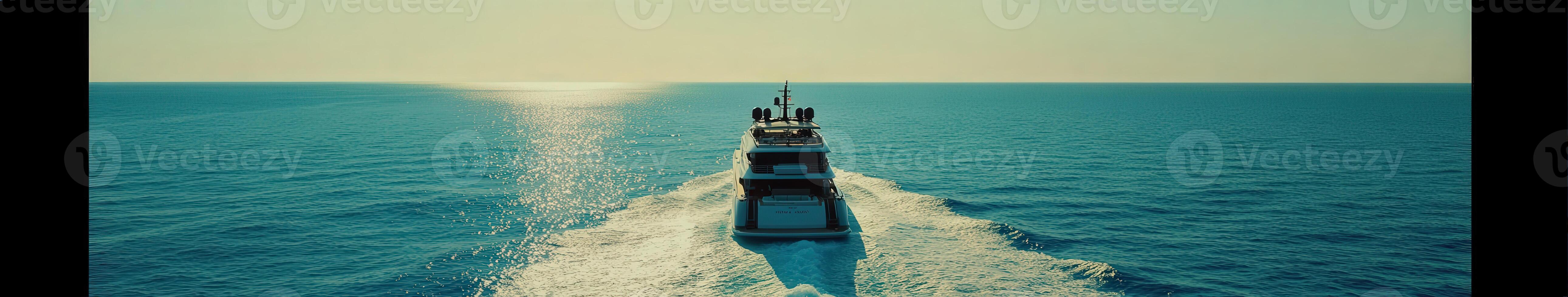 Luxurious yacht cruising over azure waters during sunset photo