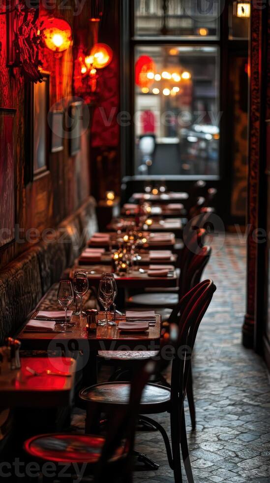 Cozy, empty restaurant with dim lighting and elegant table settings at dusk photo