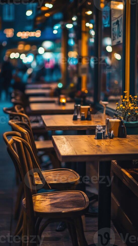 Cozy empty restaurant with inviting tables and warm lighting at dusk photo