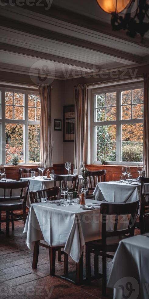 Cozy restaurant set for a fall evening dinner photo