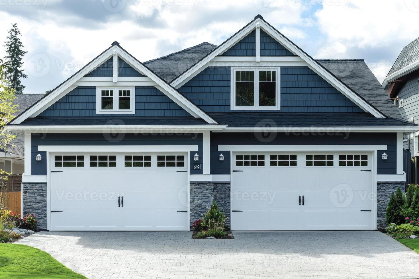New family home with a two car garage and a brick paver driveway photo