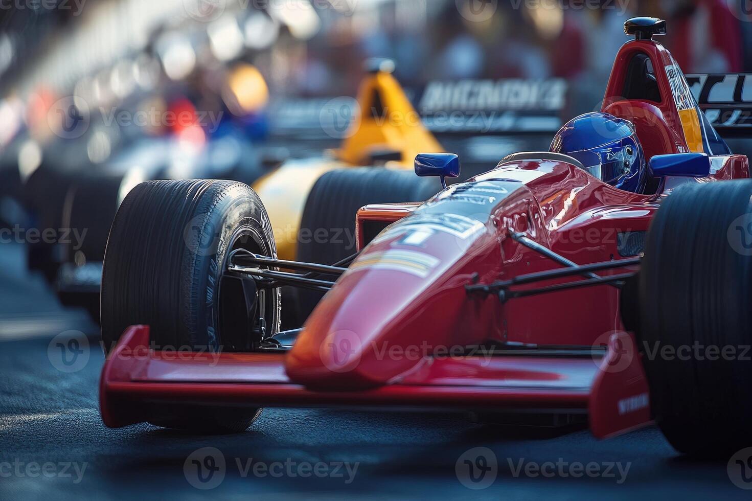 Red formula one race car waiting on the starting grid photo