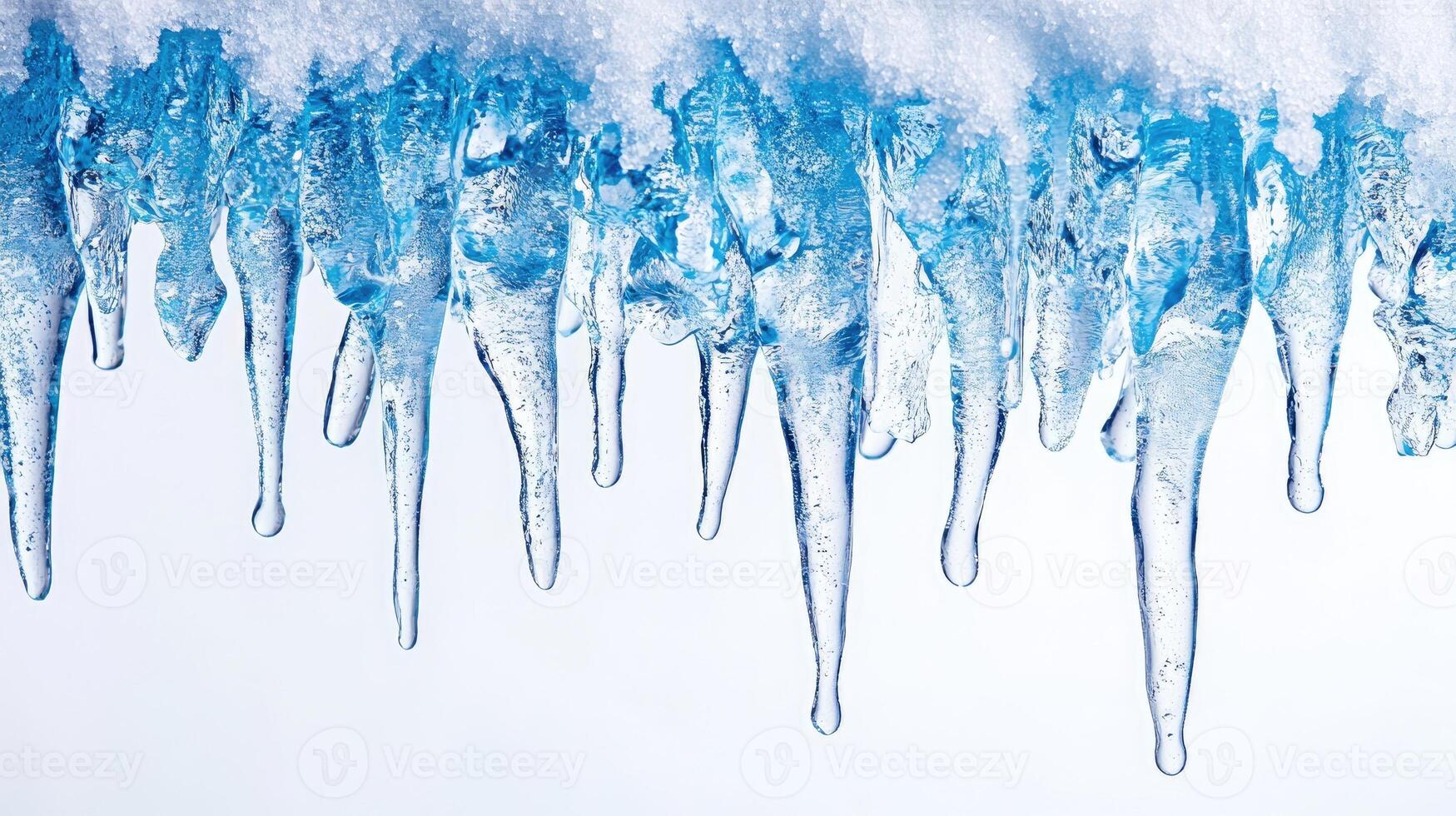 Sharp icicles hanging from roof covered with snow melting in springtime photo