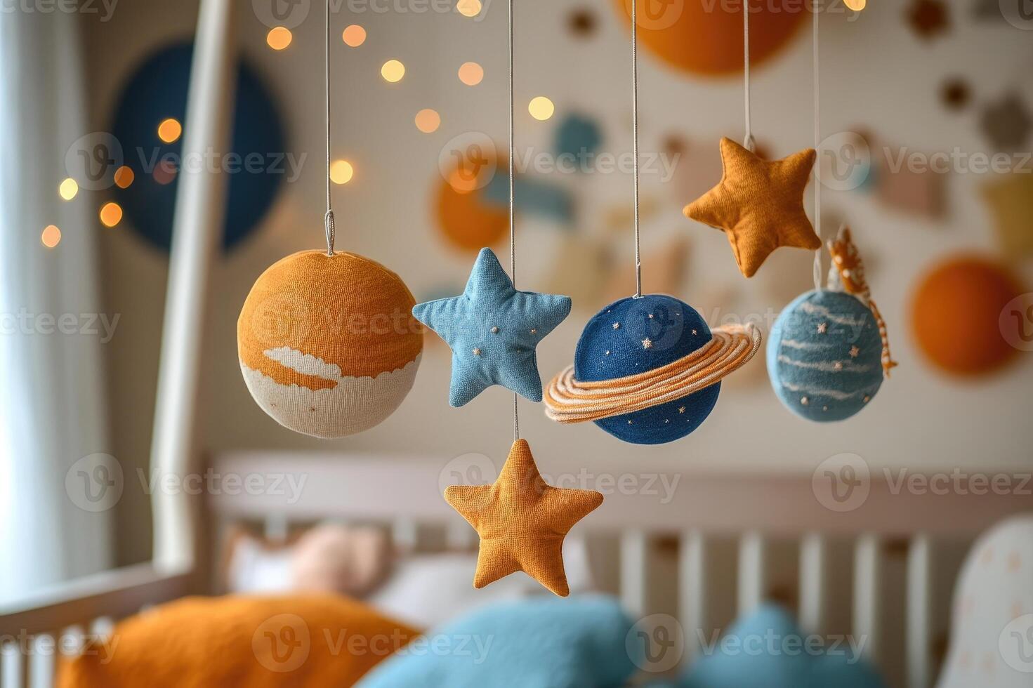 Baby mobile hanging over crib with planets and stars in a bright nursery photo