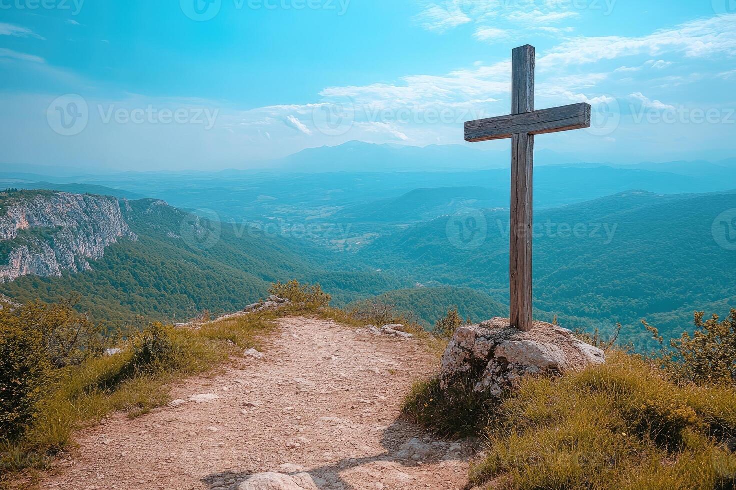 Wooden cross standing on mountain top overlooking majestic vista photo