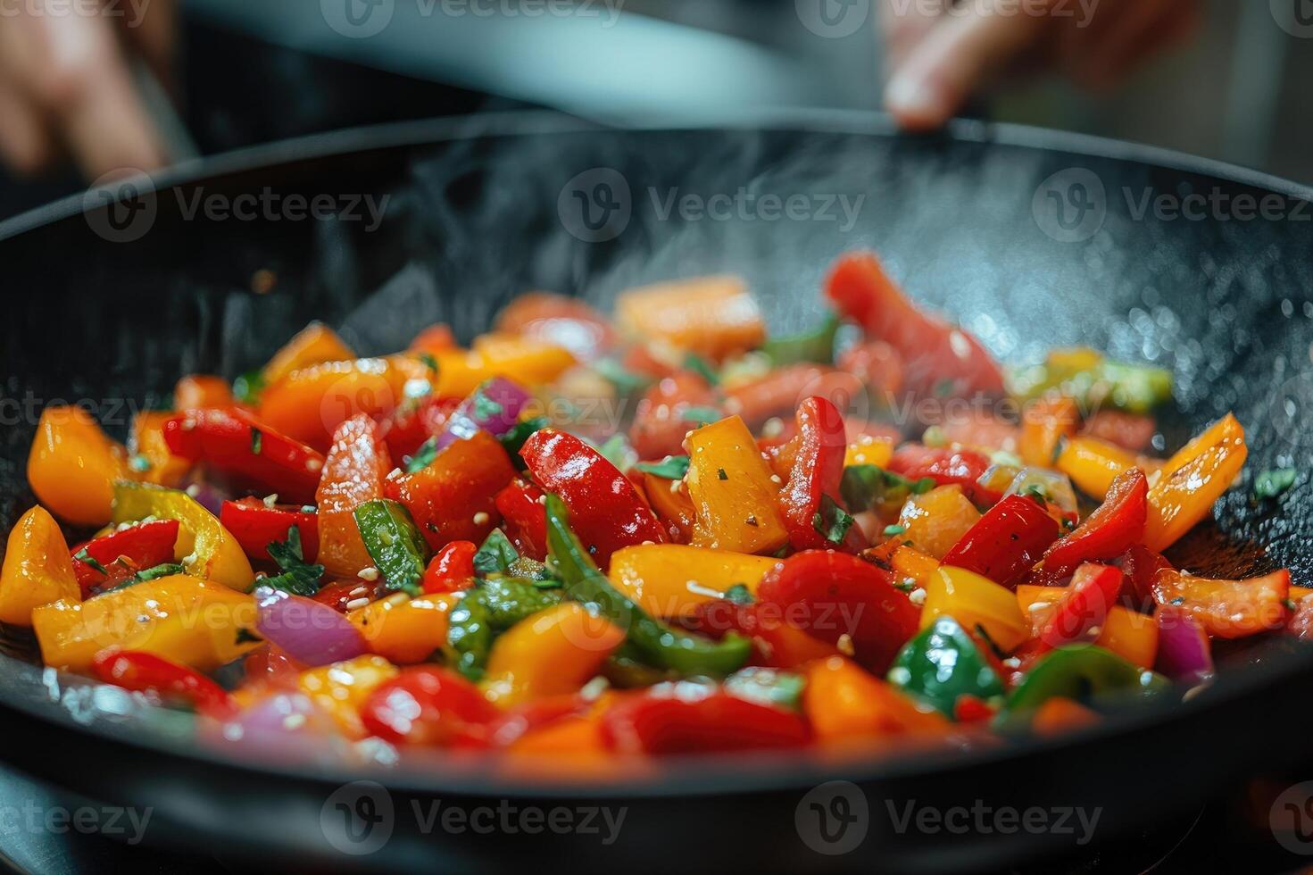 Chef holding pan with sauteed vegetables and fresh herbs photo
