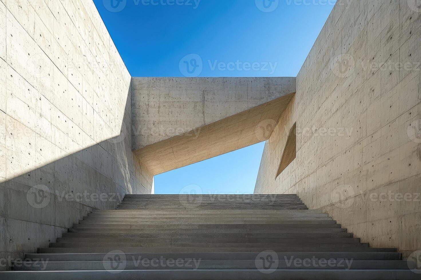 Concrete staircase leading to a bright blue sky with modern architecture photo