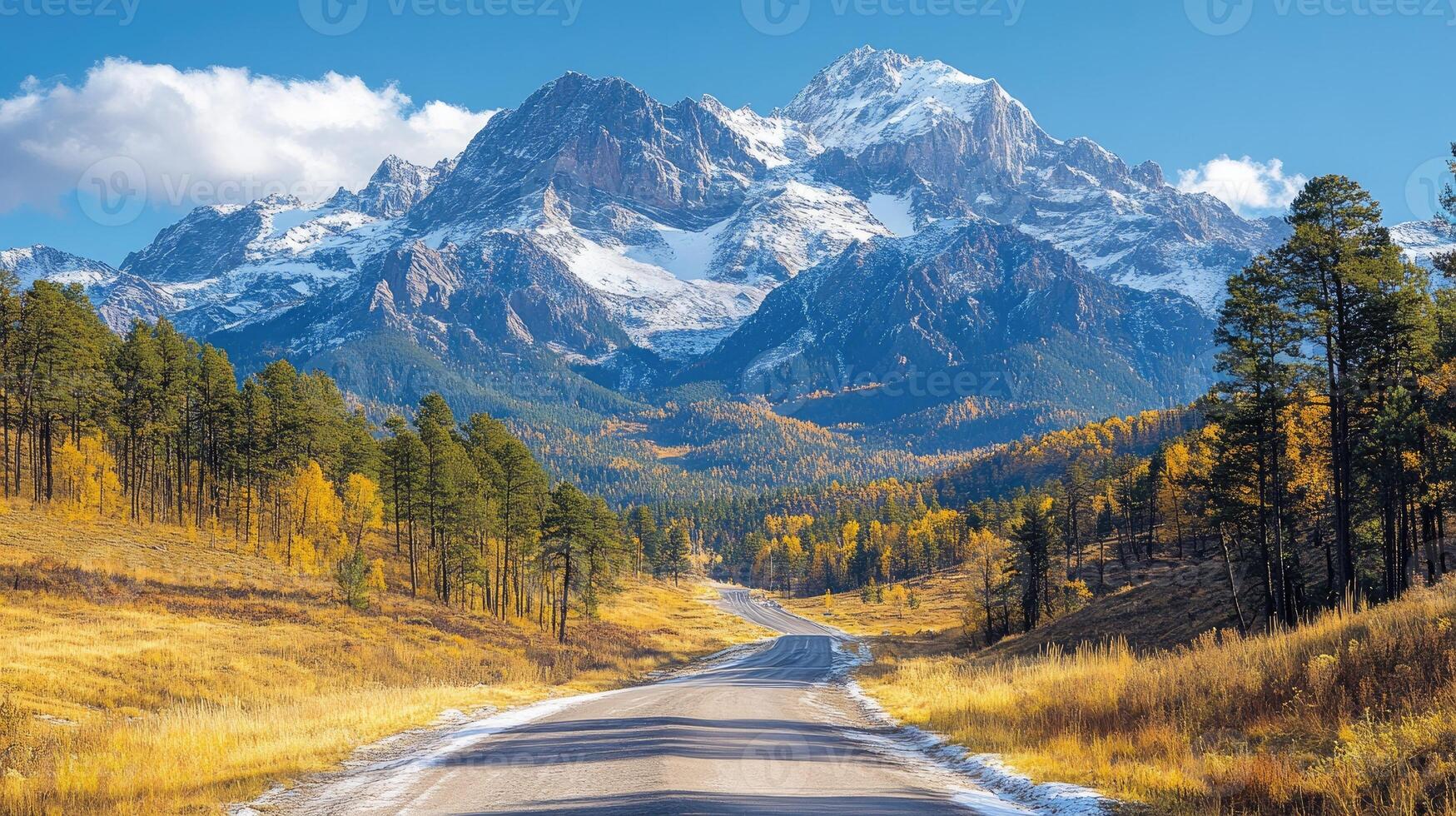 Winding road leading to the san juan mountains in autumn, colorado, usa photo