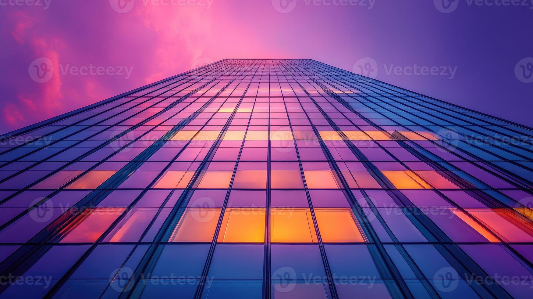 Modern office building exterior reflecting vibrant sunset colors photo