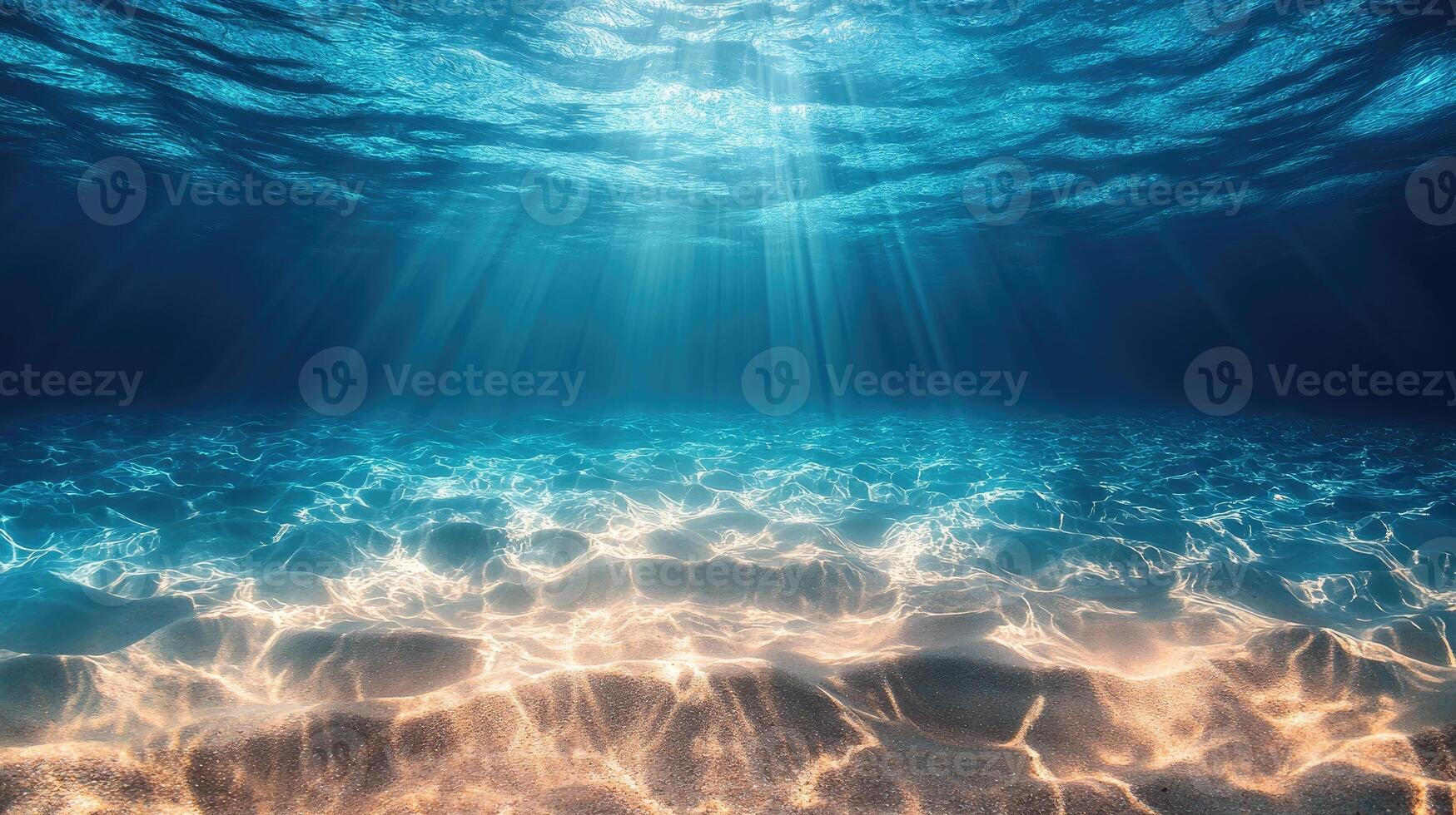 Sun shining on idyllic sandy seabed underwater ocean scene photo