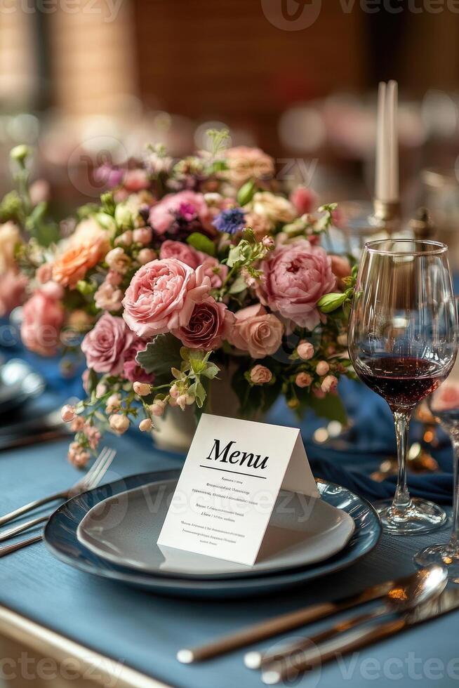 Elegant menu lying on table set for dinner in a restaurant photo