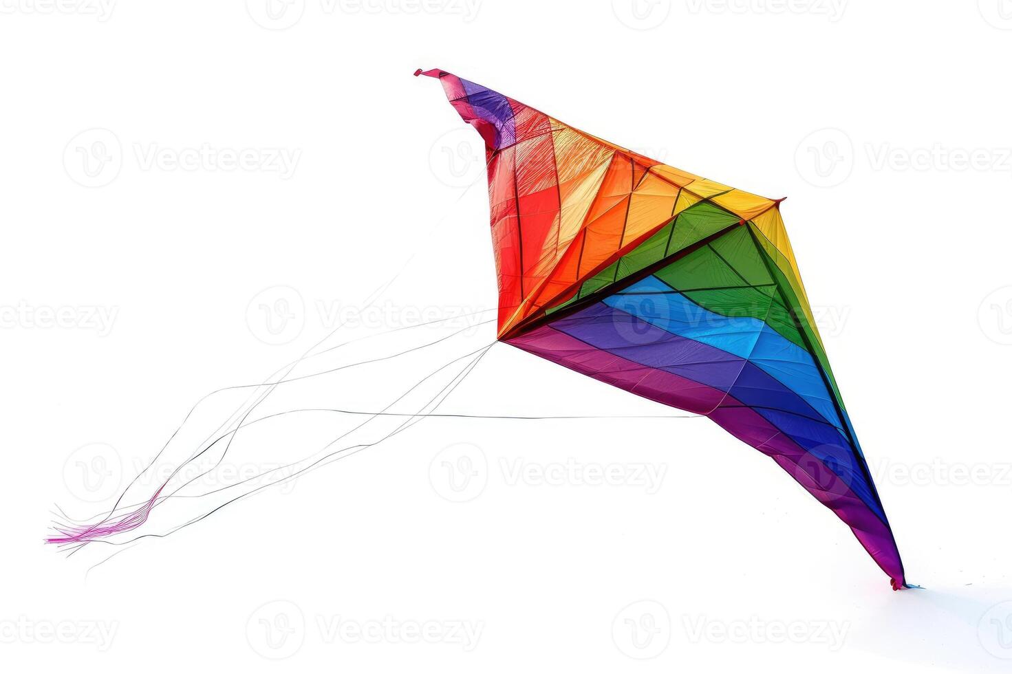 Large rainbow colored kite flying on a string photo