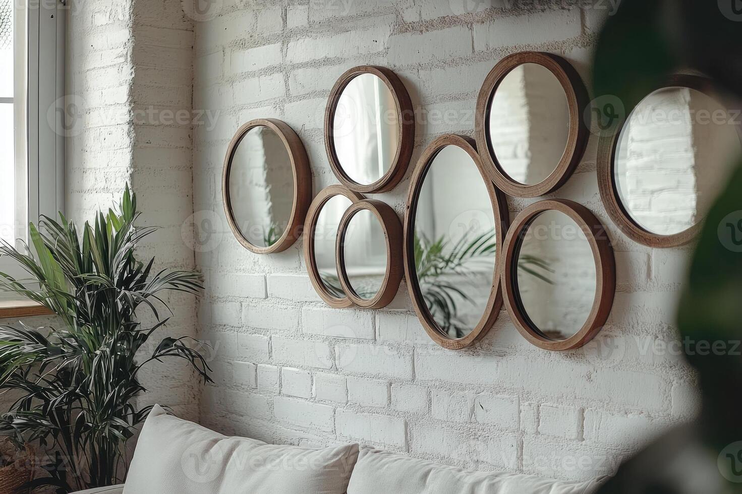 Modern living room decor featuring round mirrors on a white brick wall photo