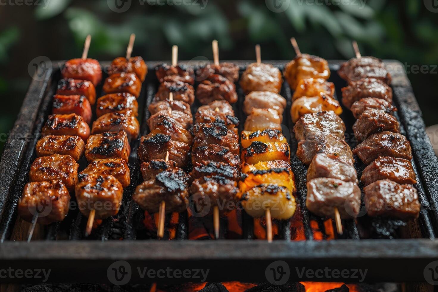Delicious barbecue meat and pineapple skewers grilling on a home grill photo