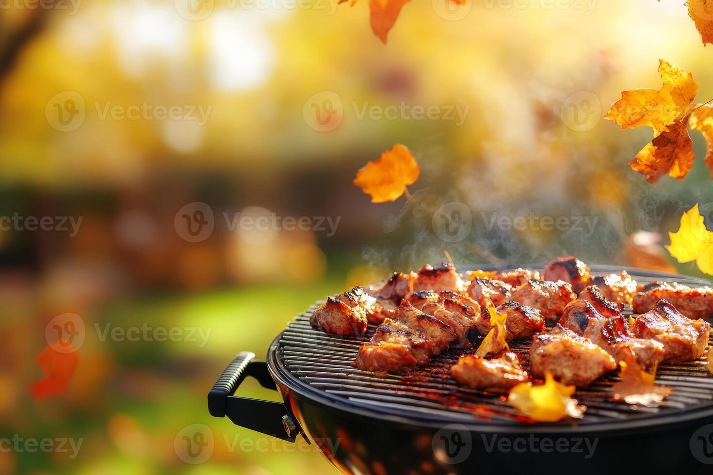 Experience the joy of savoring a mouthwatering barbecue among the stunningly vibrant autumn leaves all around you. This is truly the perfect outdoor cooking experience in a sunlit garden setting photo