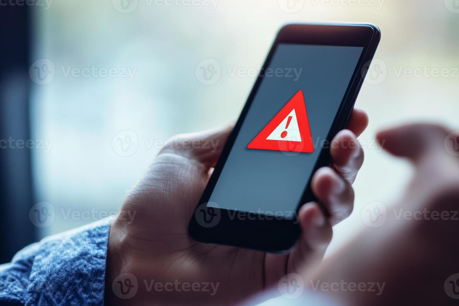 A smartphone shows a caution sign advising users about the risks of investing. It stresses the need for caution in financial decisions to avoid negative outcomes from hasty choices photo