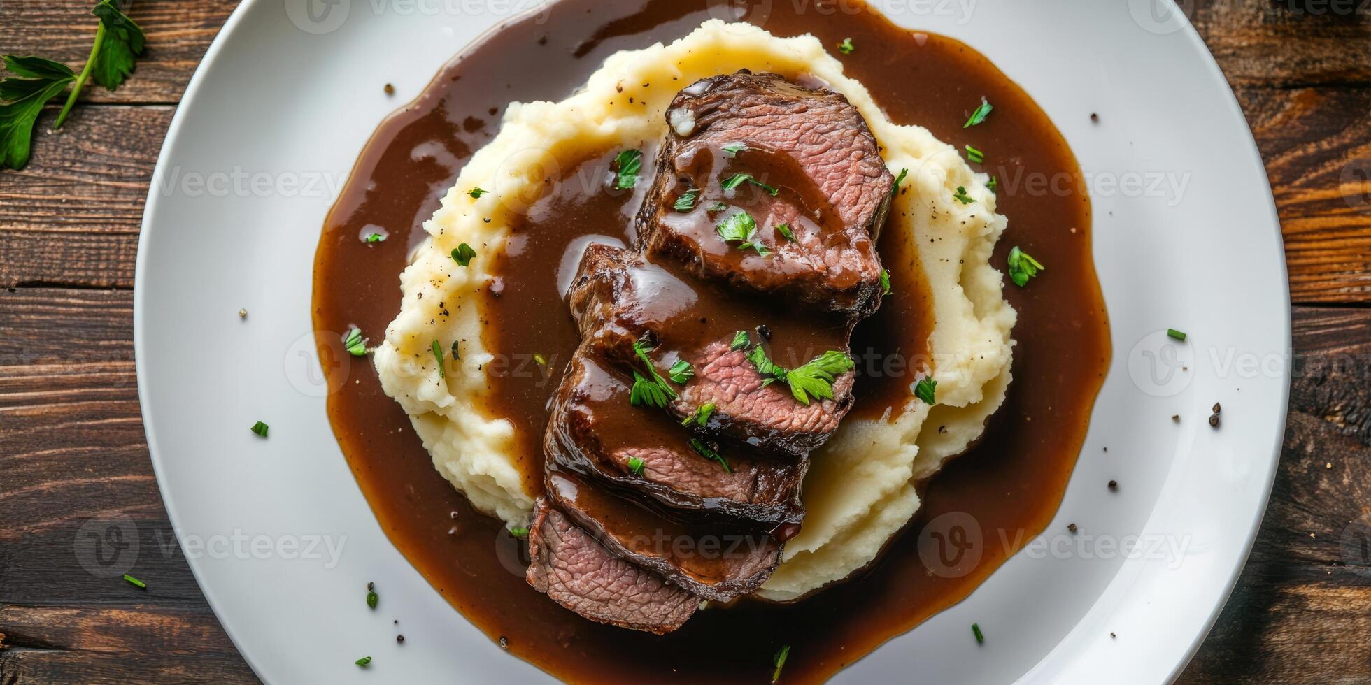 Indulge in a succulent roast beef dish, generously topped with a rich and flavorful demi glace gravy, all served alongside creamy mashed potatoes, creating a hearty and satisfying meal experience photo