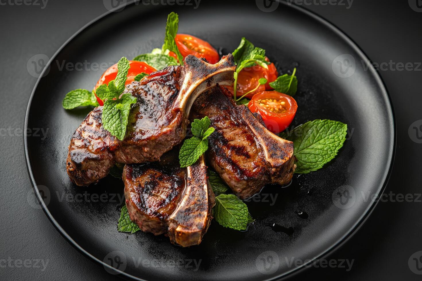 Indulge in these delicious ketogenic lamb chops that are beautifully complemented by fresh mint and a vibrant summer salad, making it the perfect choice for a healthy and satisfying meal photo