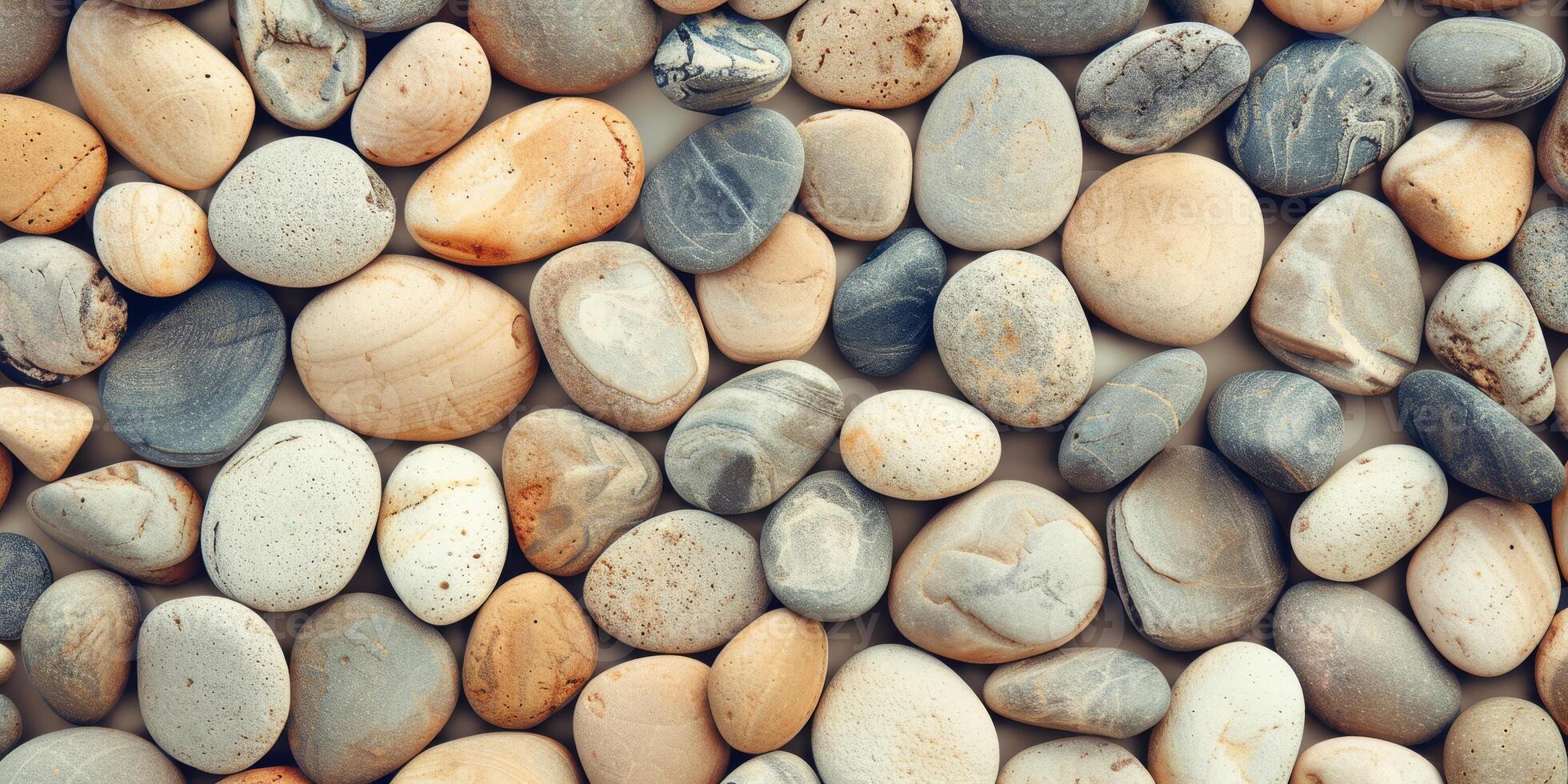 Create a peaceful atmosphere with smooth river pebbles in various hues for a natural decorative touch photo