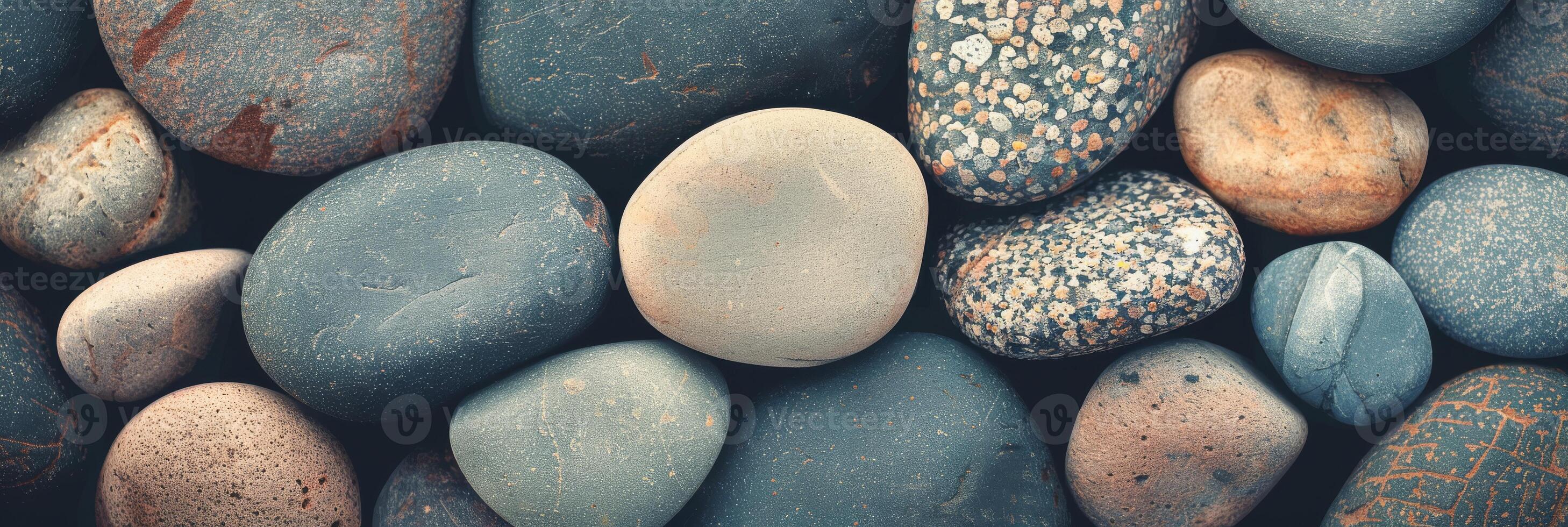 This image features a closeup of colorful and smooth pebbles, suitable for nature and relaxationrelated themes photo