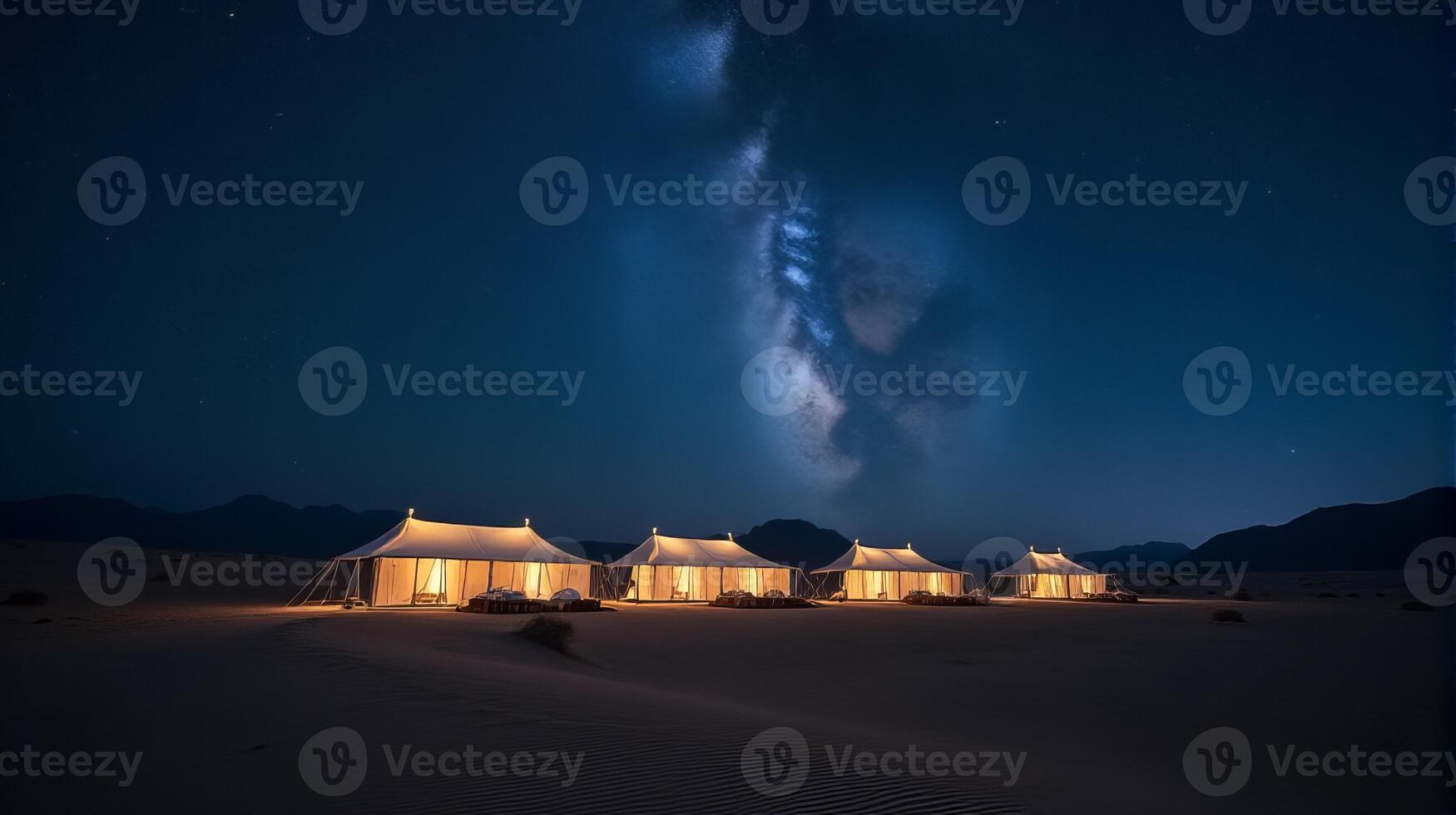 Serene Desert Night Scene Featuring a Cluster of Traditional White Tents Under a Breathtaking Milky Way Galaxy photo