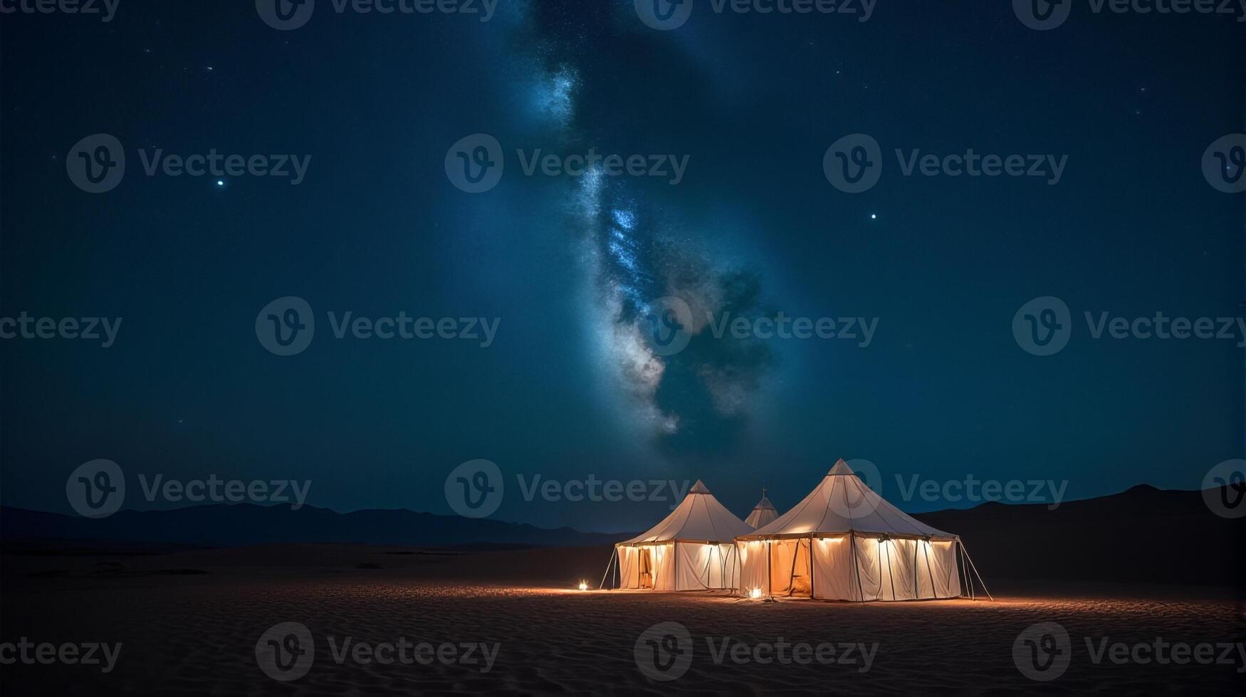 Serene Desert Night Scene Featuring a Cluster of Traditional White Tents Under a Breathtaking Milky Way Galaxy photo