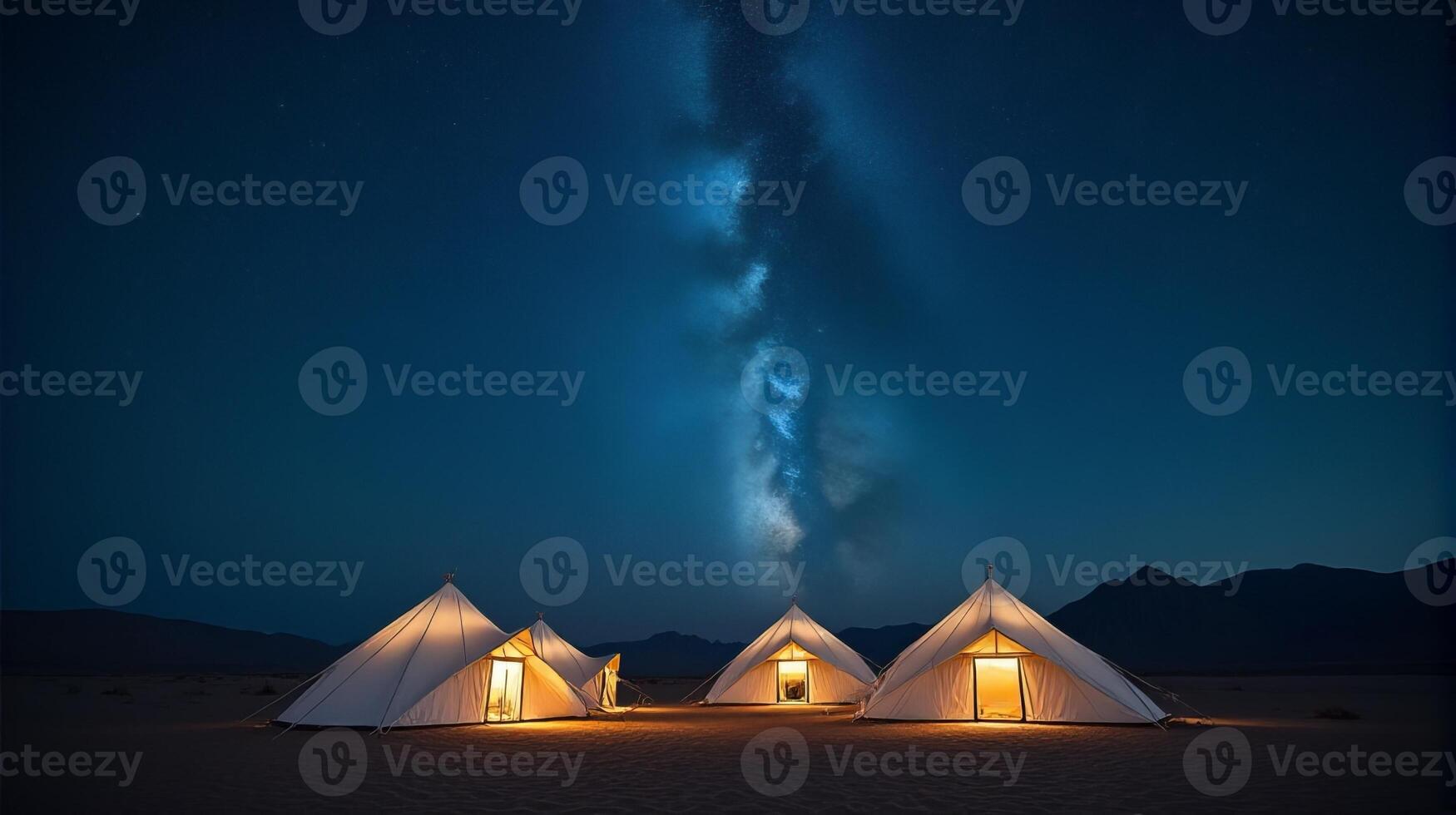 Serene Desert Night Scene Featuring a Cluster of Traditional White Tents Under a Breathtaking Milky Way Galaxy photo