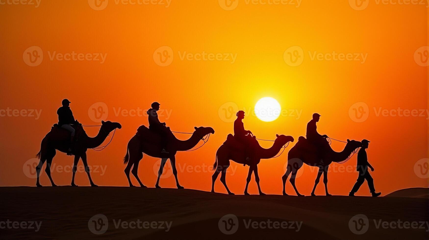 Silhouette of Camel Riders Against an Orange Hued Sky on a Desert Dunes Under Dramatic Sunset photo