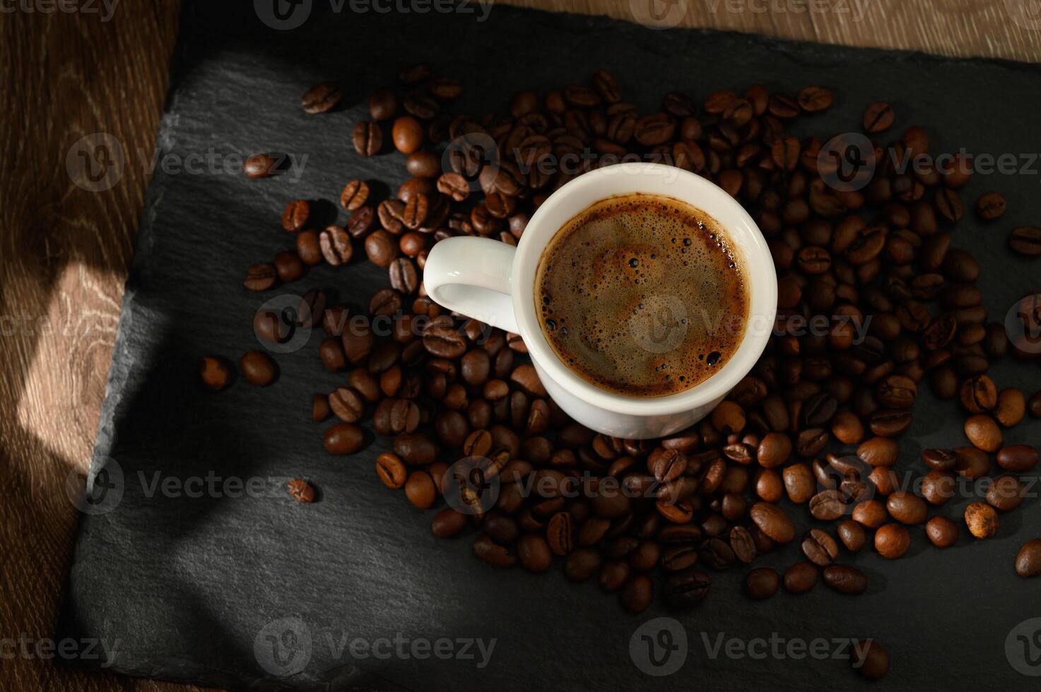 Traditional Turkish coffee cup on a wooden table photo