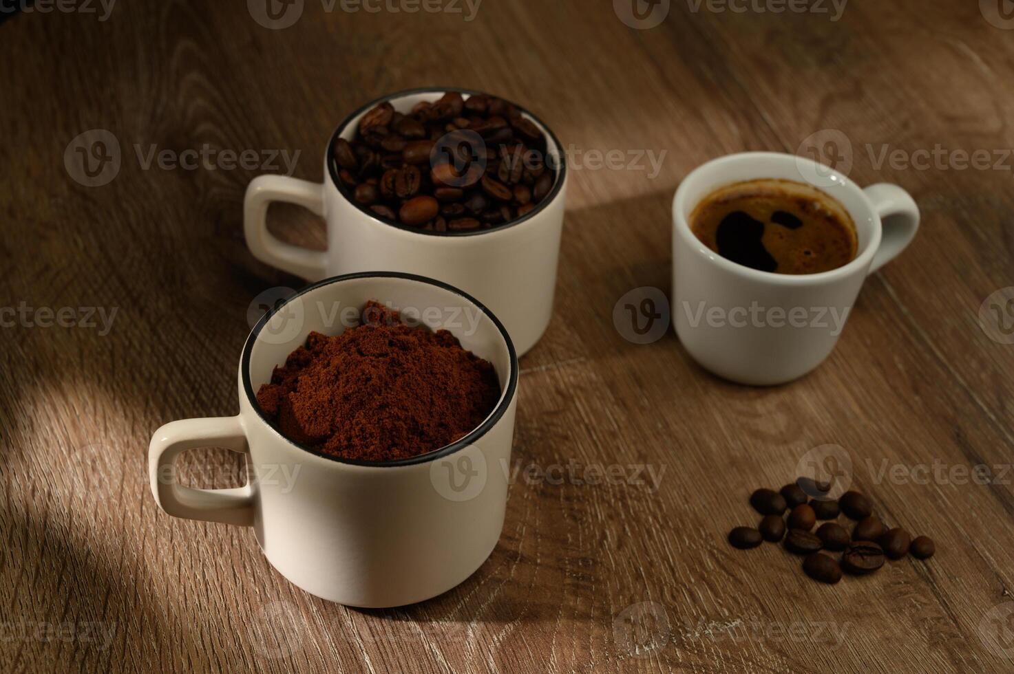 coffee cup and beans on old wooden table photo