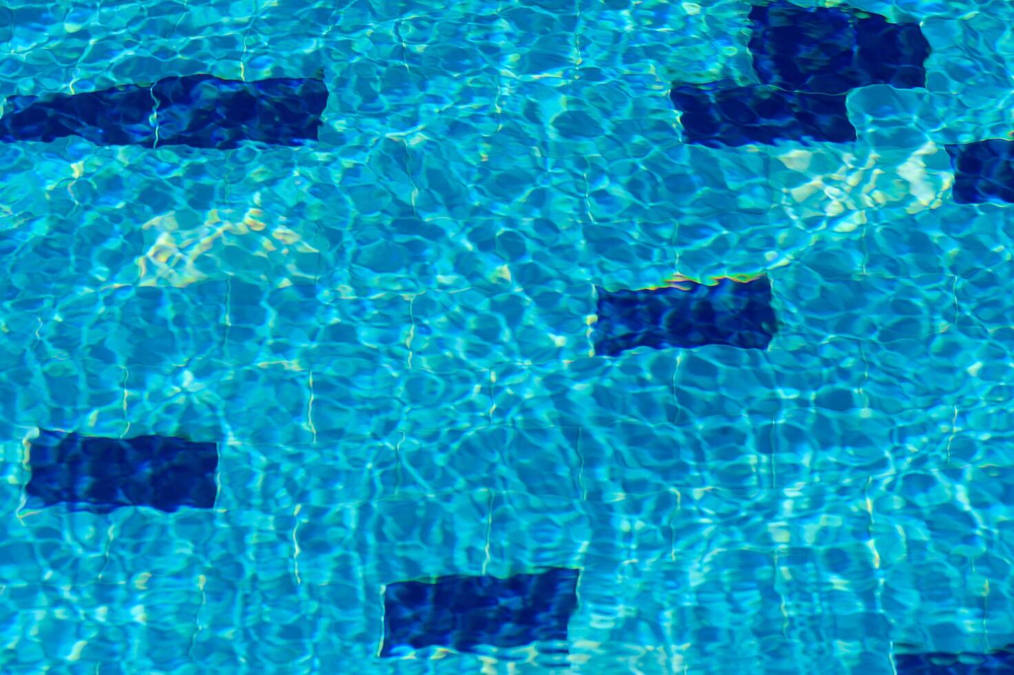 Swimming Pool Surface With Light Reflection and Water Ripple Patterns 2 photo