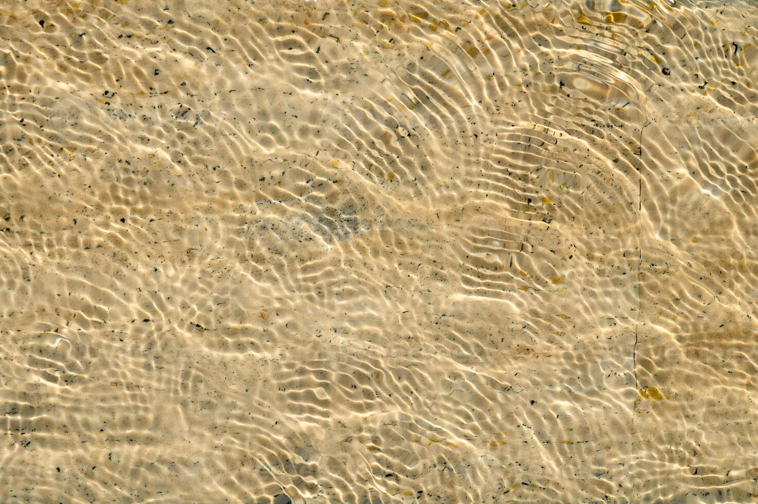 Shallow sea water and beach sand, for background and texture photo