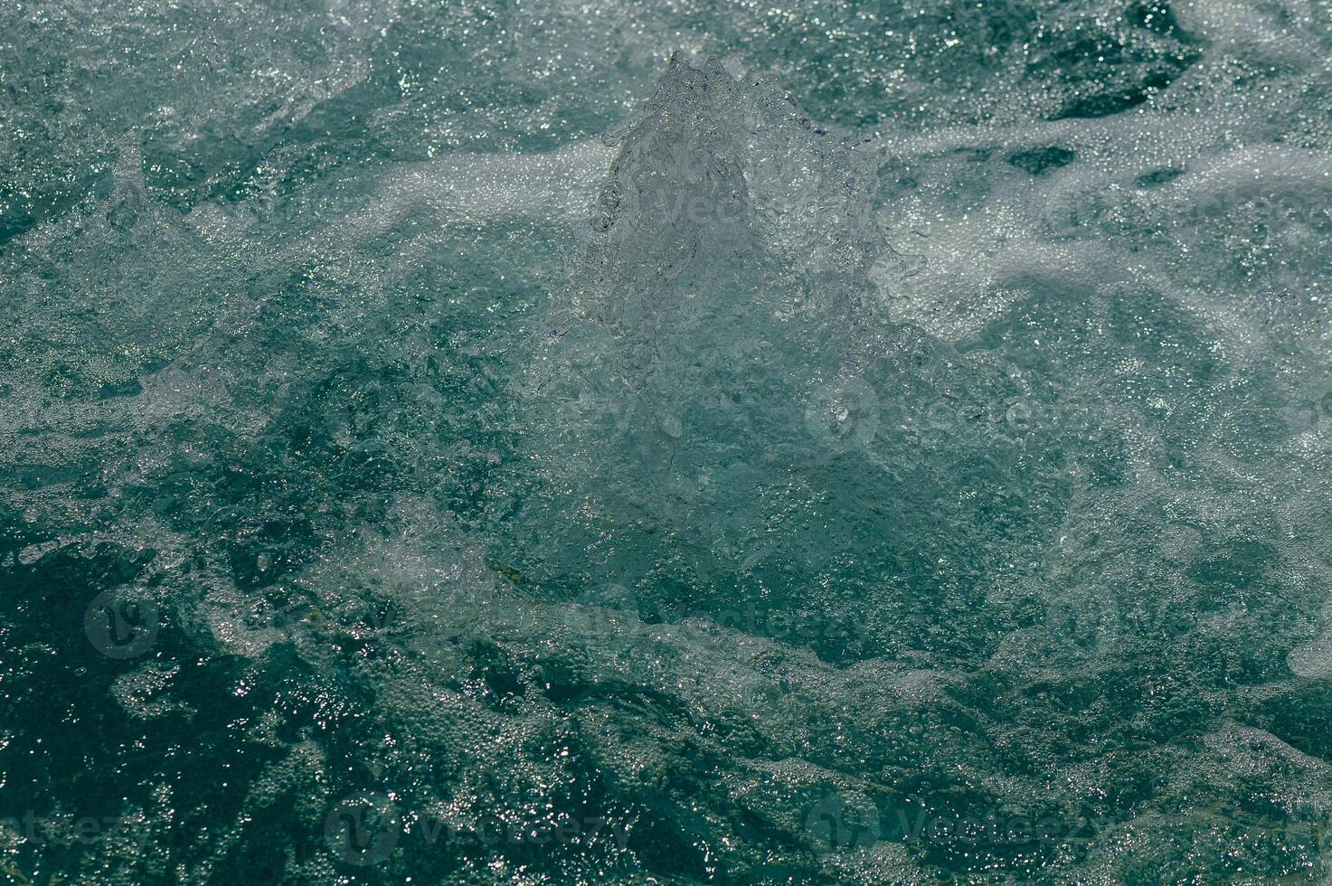 Rough water of sea surf. The water boils in rapid flow of river photo