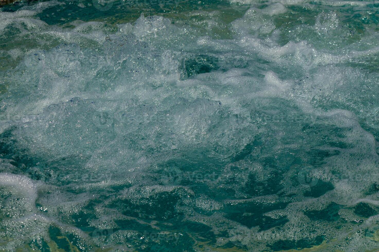 Texture of water in swimming pool for background photo