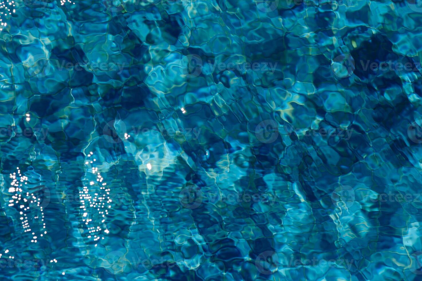 Swimming Pool Surface With Light Reflection and Water Ripple Patterns 5 photo