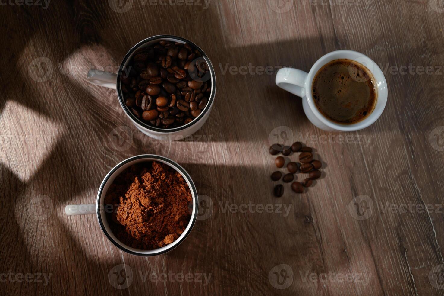 cups of coffee, phases of drink - bean, ground and empty cup. photo