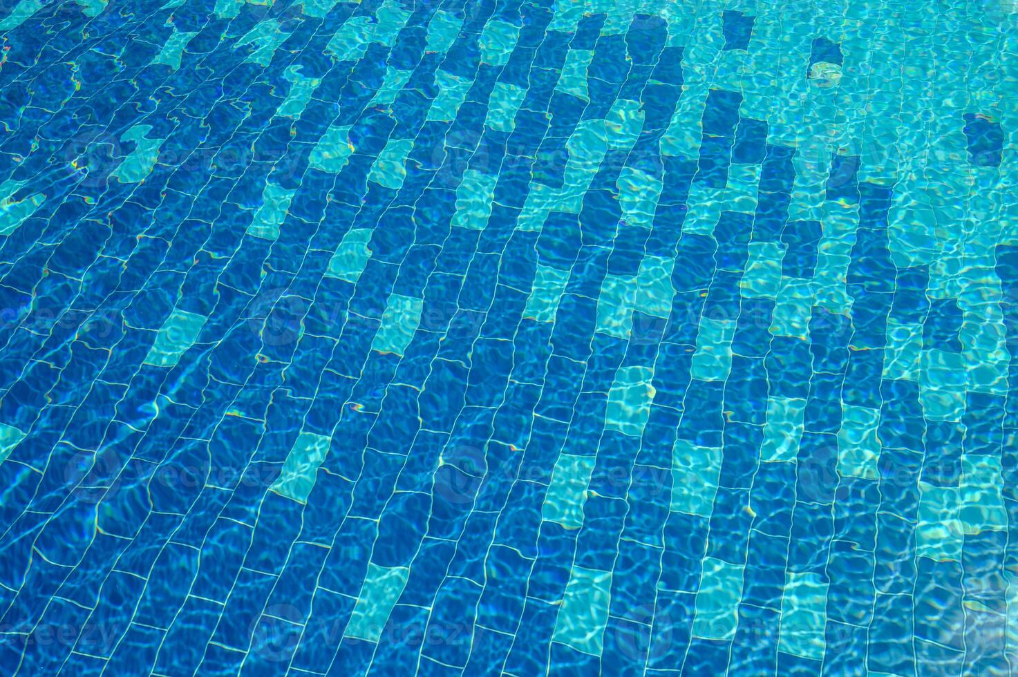 Swimming Pool Surface With Light Reflection and Water Ripple Patterns photo
