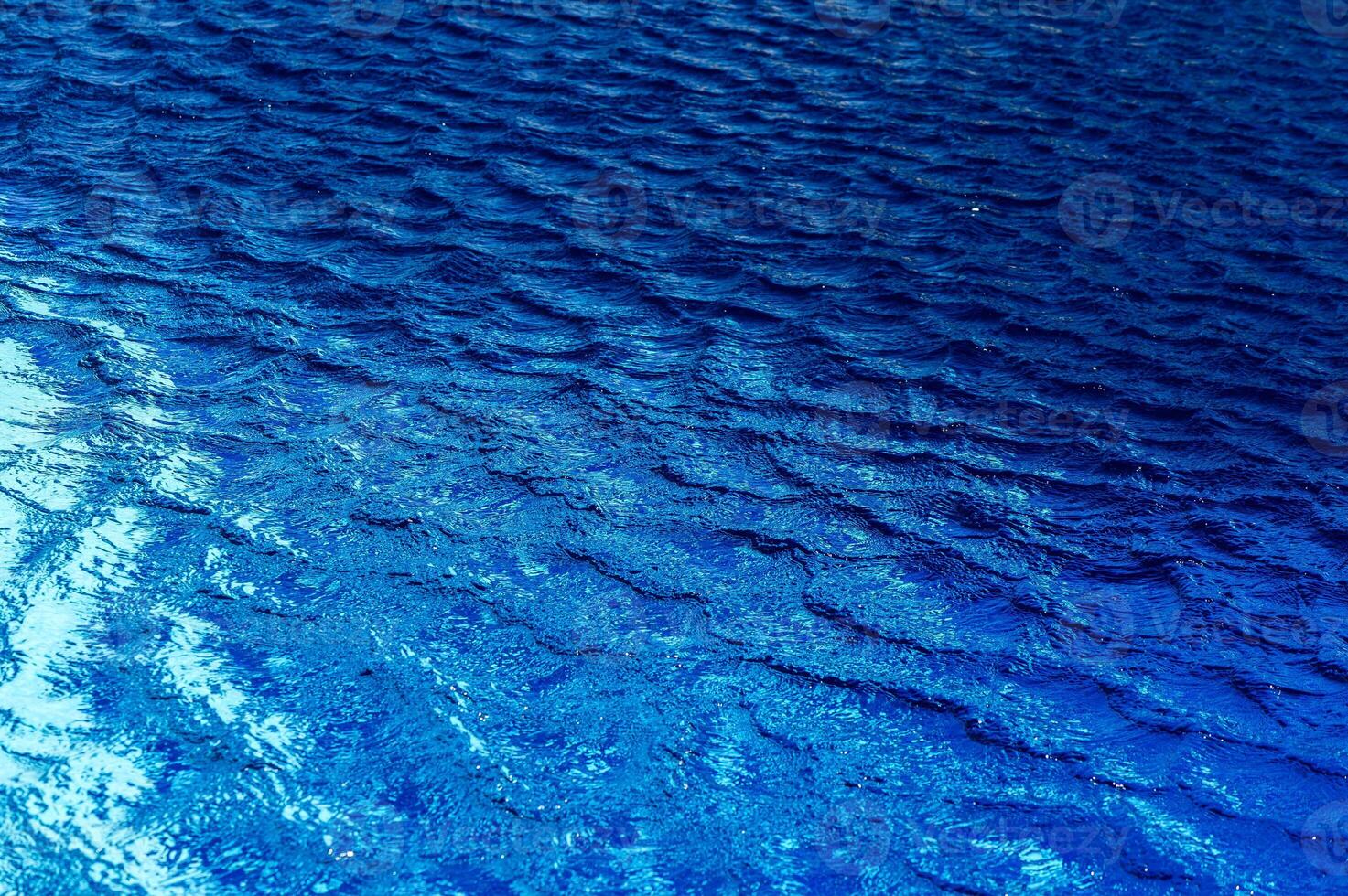 photrealistic of swimming pool water surface. water texture backgrounds. photo