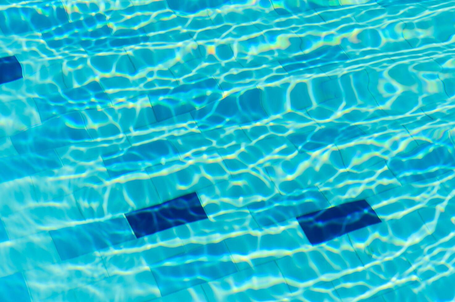 Swimming Pool Surface With Light Reflection and Water Ripple Patterns photo