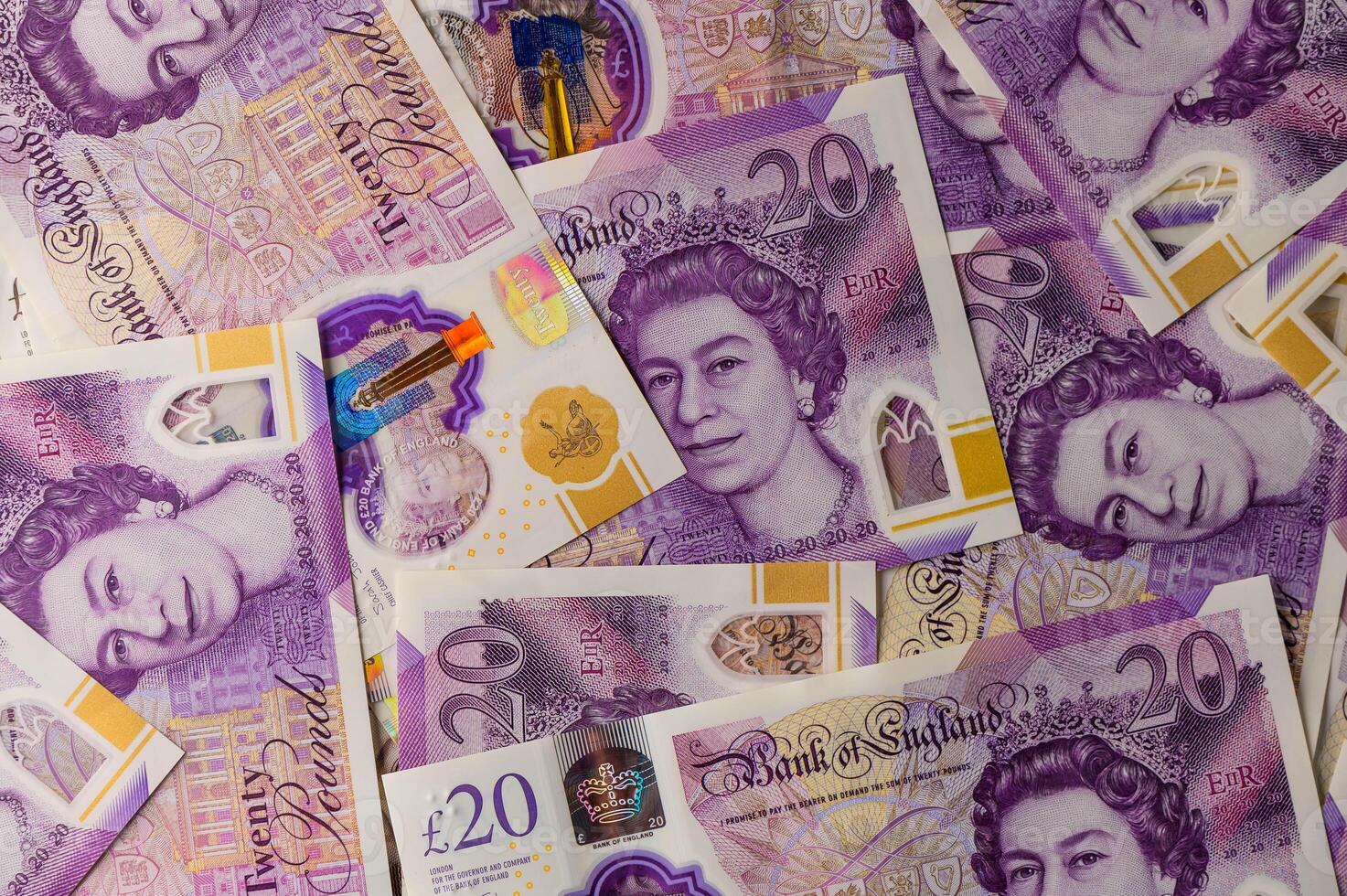 20 pound sterling bank notes closeup view business background 4 photo
